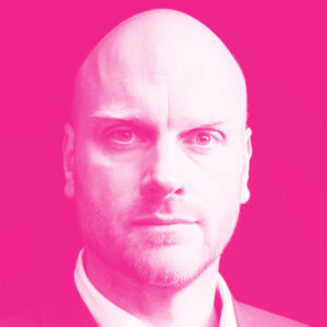Adam Hill's headshot with a hot pink filter.