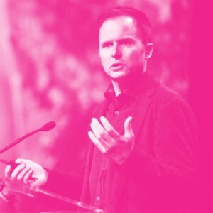 Adam Pidlisecky&#039;s headshot with a hot pink filter.