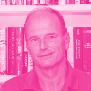 Andrew Thompson&#039;s headshot with a hot pink filter.