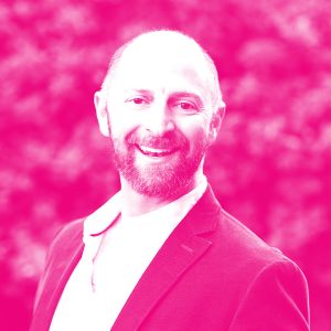 Barney Pell's headshot with a hot pink filter.