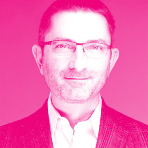 Ben Heywood's headshot with a hot pink filter.