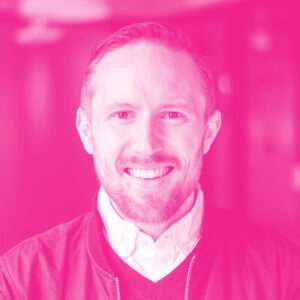 Benjamin Sanders' headshot with a hot pink filter.