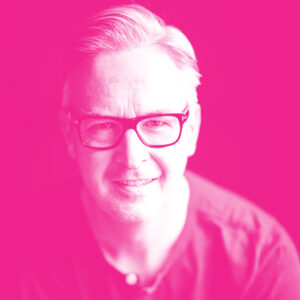 Christian Hebenstreit's headshot with a hot pink filter.