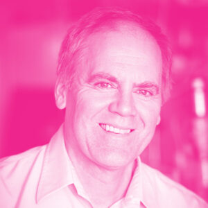 David Wilkinson's headshot with a hot pink filter.