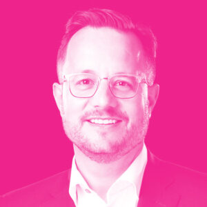 Derek Exner's headshot with a hot pink filter.