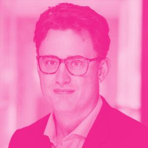 Edouard Asselin's headshot with a hot pink filter.