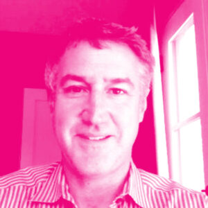 Eric Hixon's headshot with a hot pink filter.