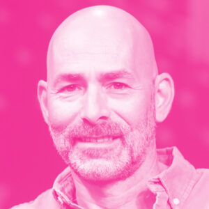 Gil Arazi's headshot with a hot pink filter.