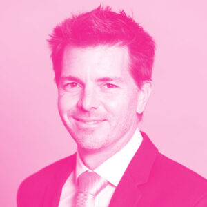 Guillaume Lhermie's headshot with a hot pink filter.
