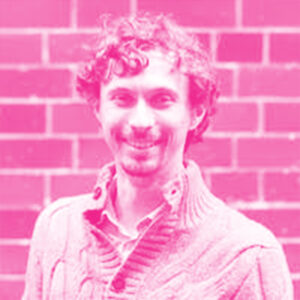 James Crowley's headshot with a hot pink filter.