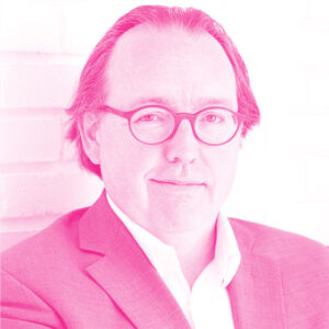 Jean Schmitt's headshot with a hot pink filter.