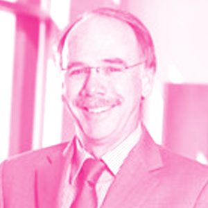 Jim Hanlon's headshot with a hot pink filter