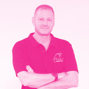 Luca Rossettini's headshot with a hot pink filter.