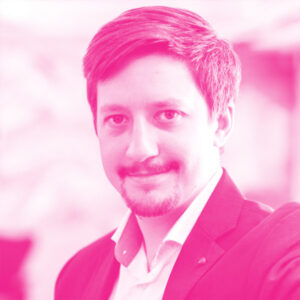 Luukas Ilves' headshot with a hot pink filter.