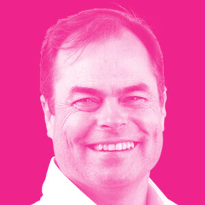 Malcolm Allen's headshot with a hot pink filter.