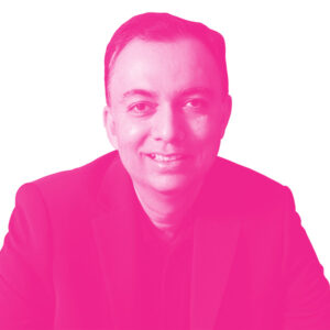 Manish Krishnan's headshot with a hot pink filter.