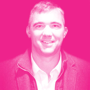 Mark Russell's headshot with a hot pink filter.