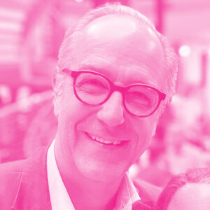 Matthias Suermondt's headshot with a hot pink filter.