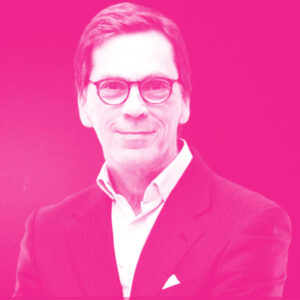 Michael Grier's headshot with a hot pink filter.