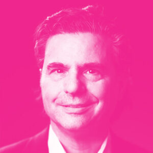 Paul Ciriello's headshot with a hot pink filter.