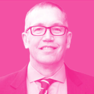 Phil Hoffmann's headshot with a hot pink filter.