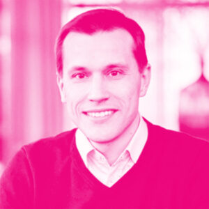 Rainer Sternfe&#039;s headshot with a hot pink filter.