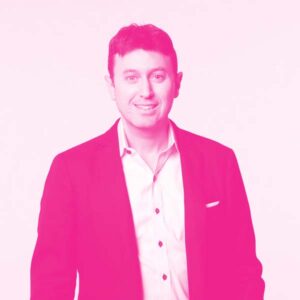 Ross Freedman's headshot with a hot pink filter.