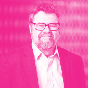 Simon Wilkie's headshot with a hot pink filter.
