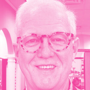 Stefan Kraemer's headshot with a hot pink filter.