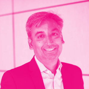 Naveen Agarwal&#039;s headshot with a hot pink filter.