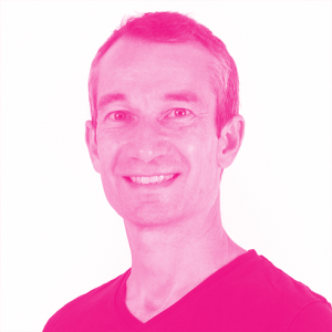Olivier Raybaud&#039;s headshot with a hot pink filter.