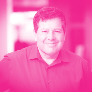 Michael Abramsky's headshot with a hot pink filter.