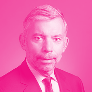 William (Bill) Schnoor&#039;s headshot with a hot pink filter.